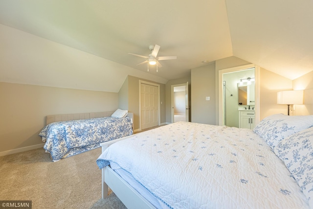 509 Superior Ave, Crosby, MN 56441 - carpeted bedroom with baseboards, vaulted ceiling, ensuite bathroom, and a closet