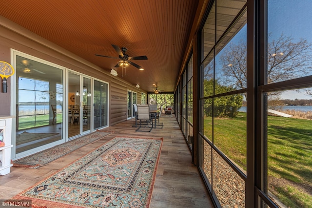 509 Superior Ave, Crosby, MN 56441 - unfurnished sunroom featuring a water view, a ceiling fan, and a healthy amount of sunlight