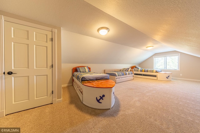 509 Superior Ave, Crosby, MN 56441 - carpeted bedroom with baseboards, vaulted ceiling, and a textured ceiling