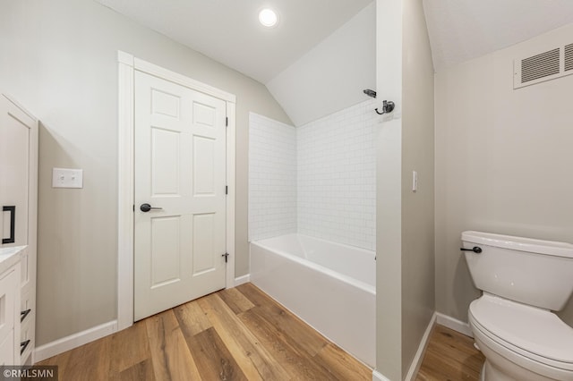 509 Superior Ave, Crosby, MN 56441 - bathroom featuring toilet, vaulted ceiling, wood finished floors, and visible vents