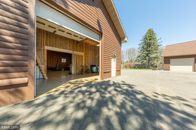 509 Superior Ave, Crosby, MN 56441 - view of property exterior with a garage and log veneer siding