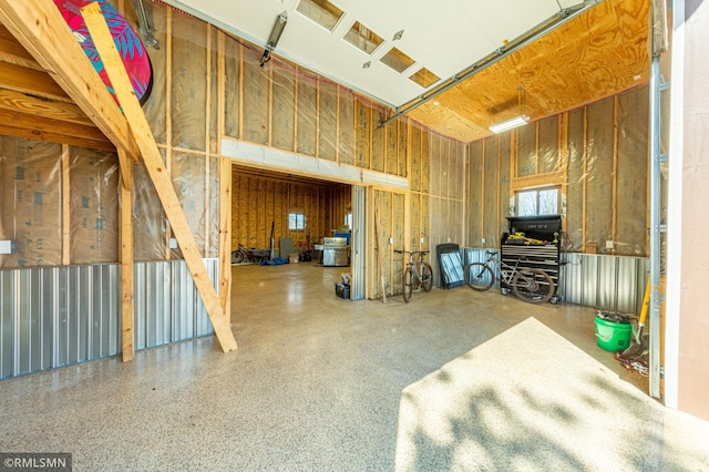 509 Superior Ave, Crosby, MN 56441 - misc room featuring a garage and speckled floor