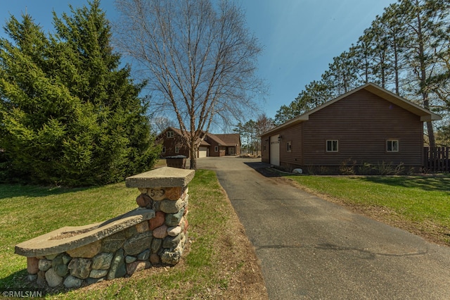 509 Superior Ave, Crosby, MN 56441 - view of property exterior featuring a lawn and a detached garage