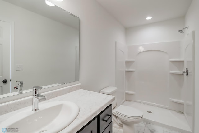 bathroom with vanity, toilet, marble finish floor, recessed lighting, and a stall shower