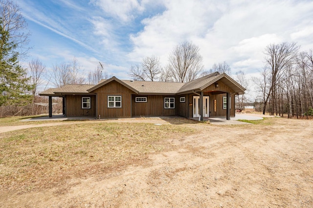 exterior space featuring a porch and driveway