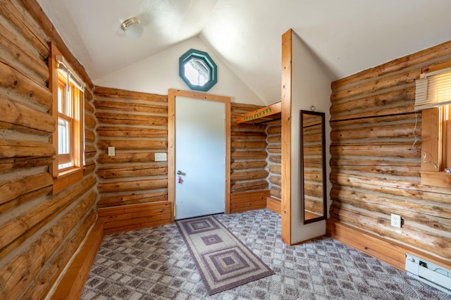 entryway with vaulted ceiling, light carpet, and log walls