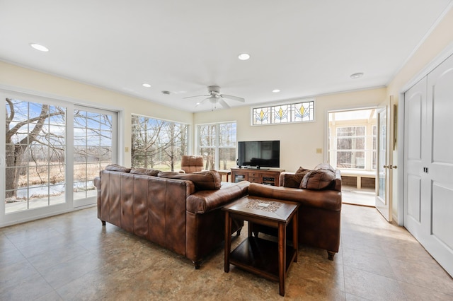 living area featuring a ceiling fan and recessed lighting
