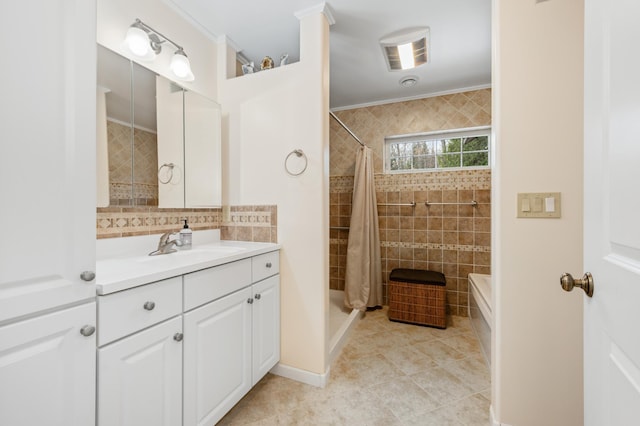 full bathroom featuring a shower with curtain, tile walls, tile patterned flooring, and vanity