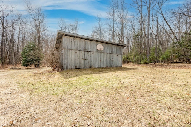 view of pole building with a lawn
