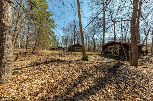 27042 Round Lake Rd, Bay Lake Twp, MN 56444 - view of yard with an outbuilding, an outdoor structure, and a garage