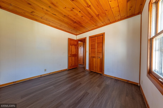 27042 Round Lake Rd, Bay Lake Twp, MN 56444 - unfurnished room with dark wood-style flooring, baseboards, and wood ceiling