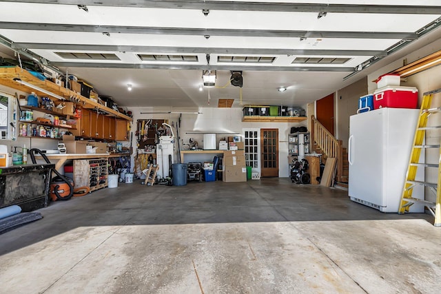 26063 County Road 2, Saint Joseph Twp, MN 56301 - garage featuring a workshop area and a garage door opener