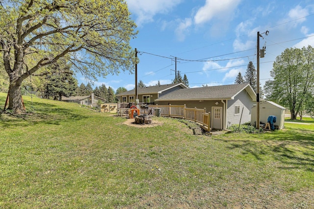 26063 County Road 2, Saint Joseph Twp, MN 56301 - view of grassy yard featuring an outdoor fire pit