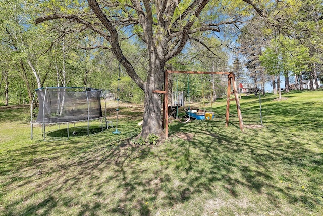 26063 County Road 2, Saint Joseph Twp, MN 56301 - view of green lawn with a trampoline and a playground
