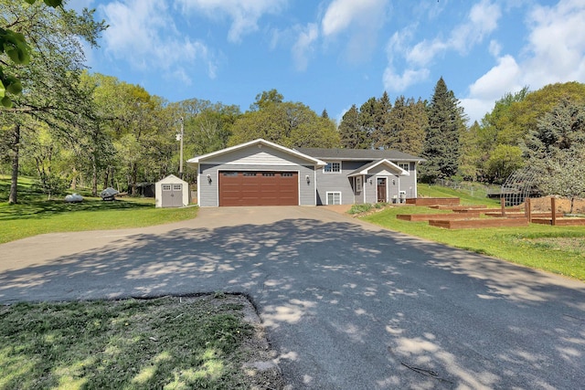 26063 County Road 2, Saint Joseph Twp, MN 56301 - view of front of home featuring a storage shed, driveway, a front yard, an outdoor structure, and an attached garage