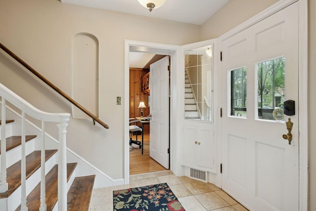 2613 Inglewood Ave S, Saint Louis Park, MN 55416 - foyer with stairs and light tile patterned flooring