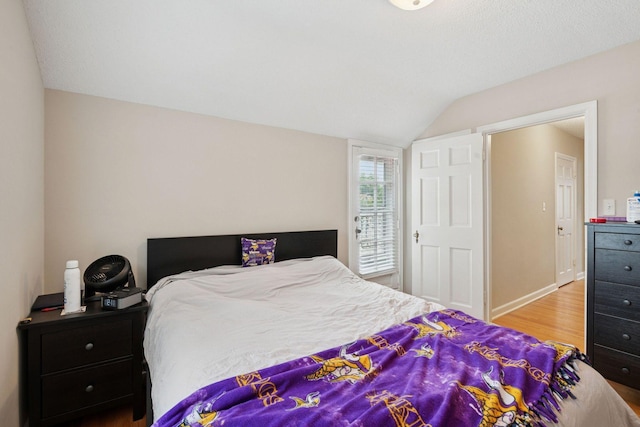 2613 Inglewood Ave S, Saint Louis Park, MN 55416 - bedroom featuring vaulted ceiling and wood finished floors