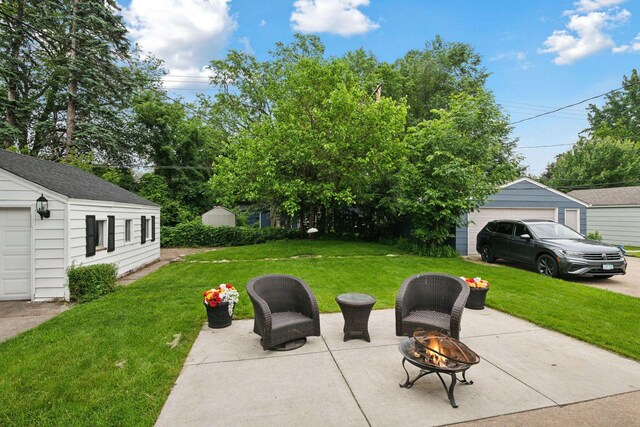 2613 Inglewood Ave S, Saint Louis Park, MN 55416 - view of patio with a fire pit and an outbuilding
