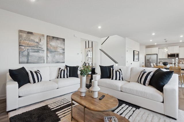 living area featuring recessed lighting and light wood-style flooring