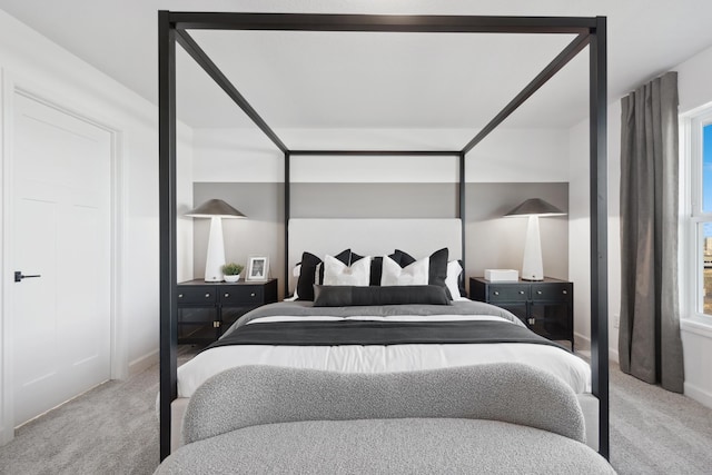 carpeted bedroom with baseboards