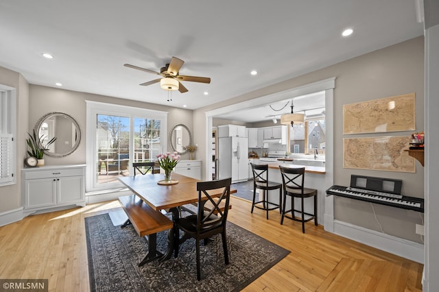 dining space with recessed lighting, ceiling fan, and light wood-type flooring