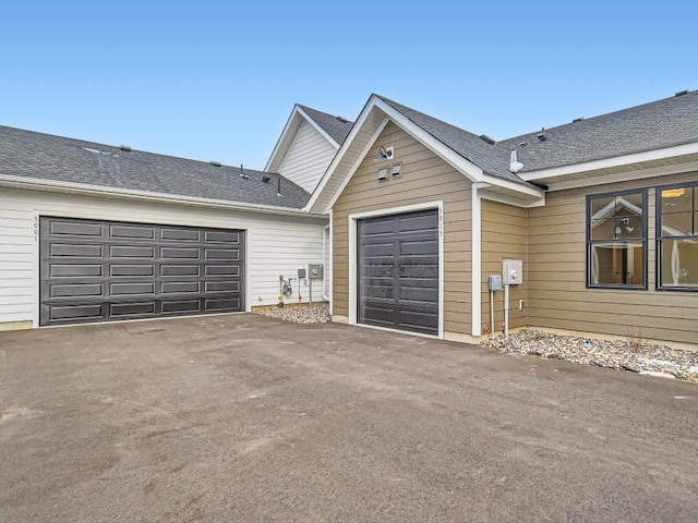 garage featuring driveway