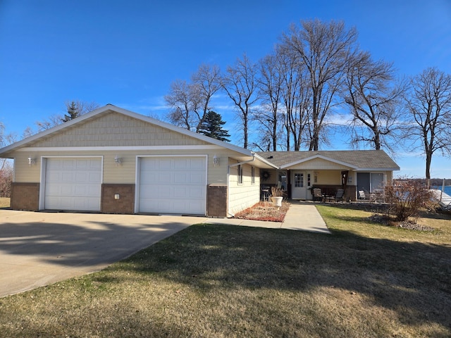 22694 Coney Island Dr, Clitherall, MN 56524 - ranch-style home featuring concrete driveway, brick siding, a front yard, and roof with shingles