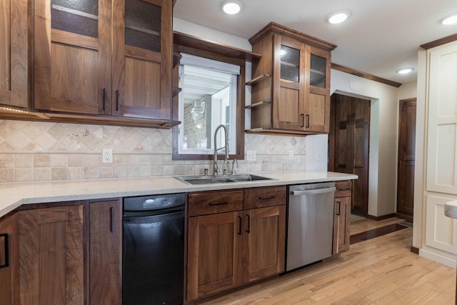 22694 Coney Island Dr, Clitherall, MN 56524 - kitchen featuring dishwasher, a sink, light wood finished floors, tasteful backsplash, and glass insert cabinets
