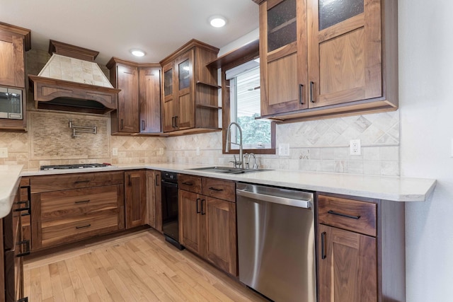 22694 Coney Island Dr, Clitherall, MN 56524 - kitchen with appliances with stainless steel finishes, a sink, light wood-style floors, premium range hood, and open shelves