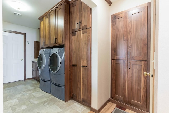22694 Coney Island Dr, Clitherall, MN 56524 - laundry area with cabinet space, independent washer and dryer, and baseboards