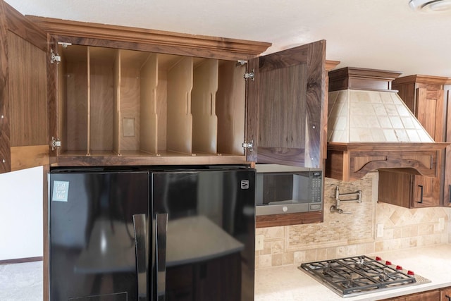 22694 Coney Island Dr, Clitherall, MN 56524 - kitchen featuring stainless steel appliances, decorative backsplash, light countertops, and brown cabinetry