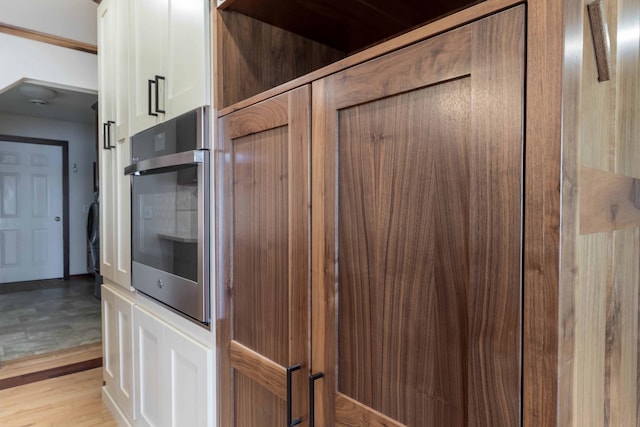 22694 Coney Island Dr, Clitherall, MN 56524 - kitchen view of oven and white cabinetry