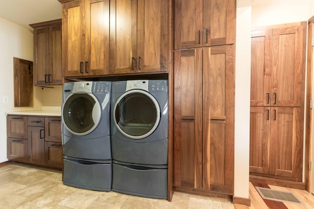 22694 Coney Island Dr, Clitherall, MN 56524 - washroom with cabinet space and separate washer and dryer