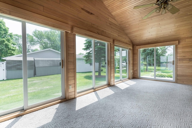 22694 Coney Island Dr, Clitherall, MN 56524 - unfurnished sunroom with lofted ceiling, ceiling fan, carpet, wood walls, and wooden ceiling