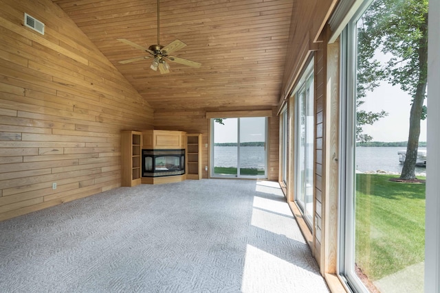 22694 Coney Island Dr, Clitherall, MN 56524 - unfurnished sunroom featuring a water view, wooden walls, lofted ceiling, wood ceiling, and carpet flooring