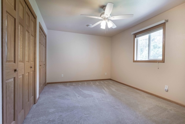 22694 Coney Island Dr, Clitherall, MN 56524 - unfurnished bedroom with light carpet, baseboards, and ceiling fan
