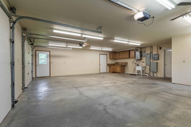 22694 Coney Island Dr, Clitherall, MN 56524 - garage featuring a garage door opener and electric panel