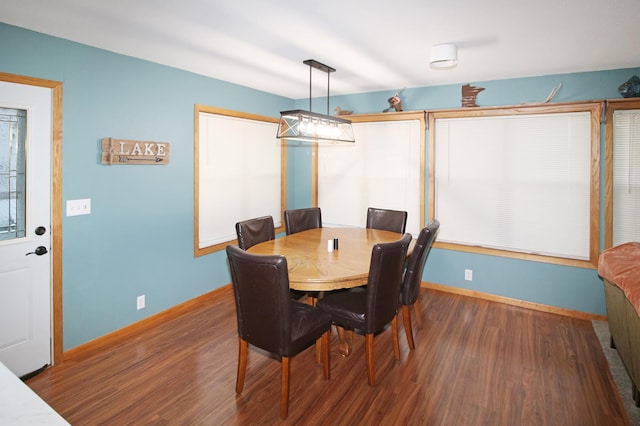 dining room with wood finished floors and baseboards