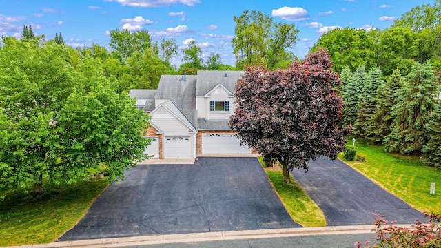 5676 Donegal Dr, Shoreview, MN 55126 - view of front of home with a garage and driveway