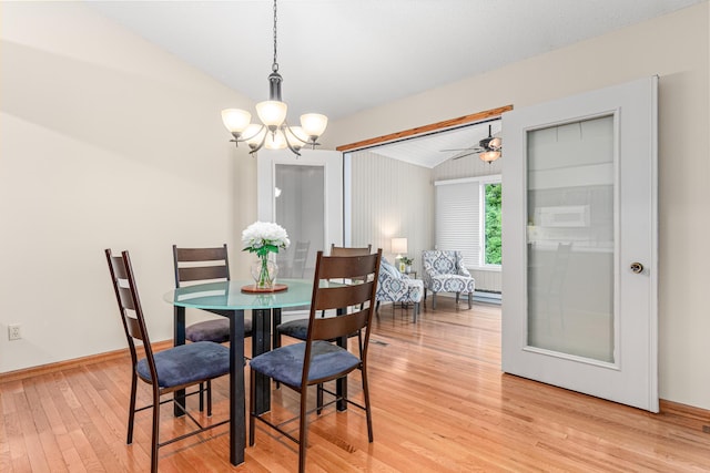5676 Donegal Dr, Shoreview, MN 55126 - dining area featuring light wood-style flooring, lofted ceiling, a chandelier, and baseboards