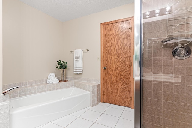 5676 Donegal Dr, Shoreview, MN 55126 - bathroom with tile patterned floors, a bath, a shower stall, and a textured ceiling
