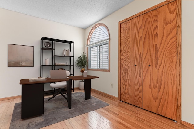 5676 Donegal Dr, Shoreview, MN 55126 - office space with hardwood / wood-style floors, a textured ceiling, and baseboards