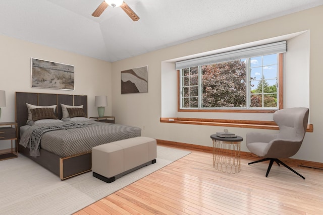5676 Donegal Dr, Shoreview, MN 55126 - bedroom featuring wood-type flooring, lofted ceiling, baseboards, and ceiling fan