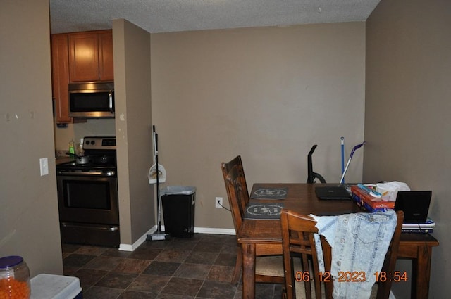 dining space featuring baseboards