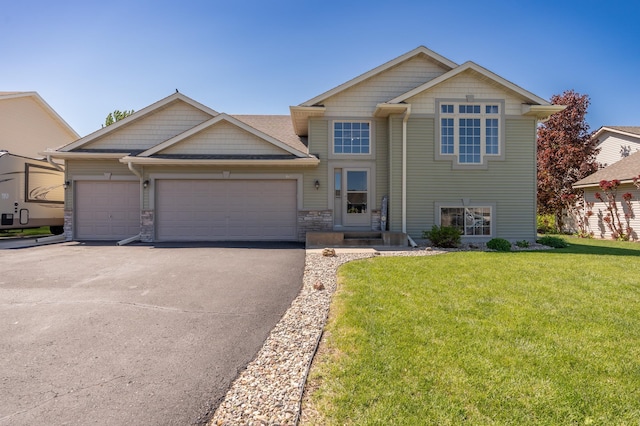 822 Emerson Ave N, Montrose, MN 55363 - craftsman house with asphalt driveway, a front yard, a garage, and stone siding