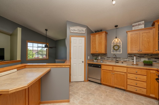 822 Emerson Ave N, Montrose, MN 55363 - kitchen featuring stainless steel dishwasher, a sink, vaulted ceiling, backsplash, and pendant lighting