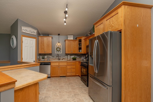 822 Emerson Ave N, Montrose, MN 55363 - kitchen featuring stainless steel appliances, a sink, glass insert cabinets, tasteful backsplash, and light countertops