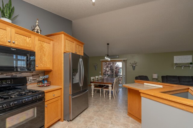 822 Emerson Ave N, Montrose, MN 55363 - kitchen featuring black appliances, light countertops, lofted ceiling, decorative backsplash, and open floor plan