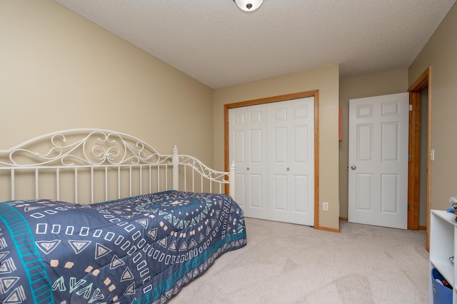 822 Emerson Ave N, Montrose, MN 55363 - bedroom with carpet floors, a closet, and a textured ceiling