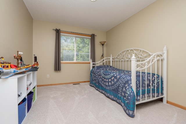 822 Emerson Ave N, Montrose, MN 55363 - carpeted bedroom with baseboards and vaulted ceiling